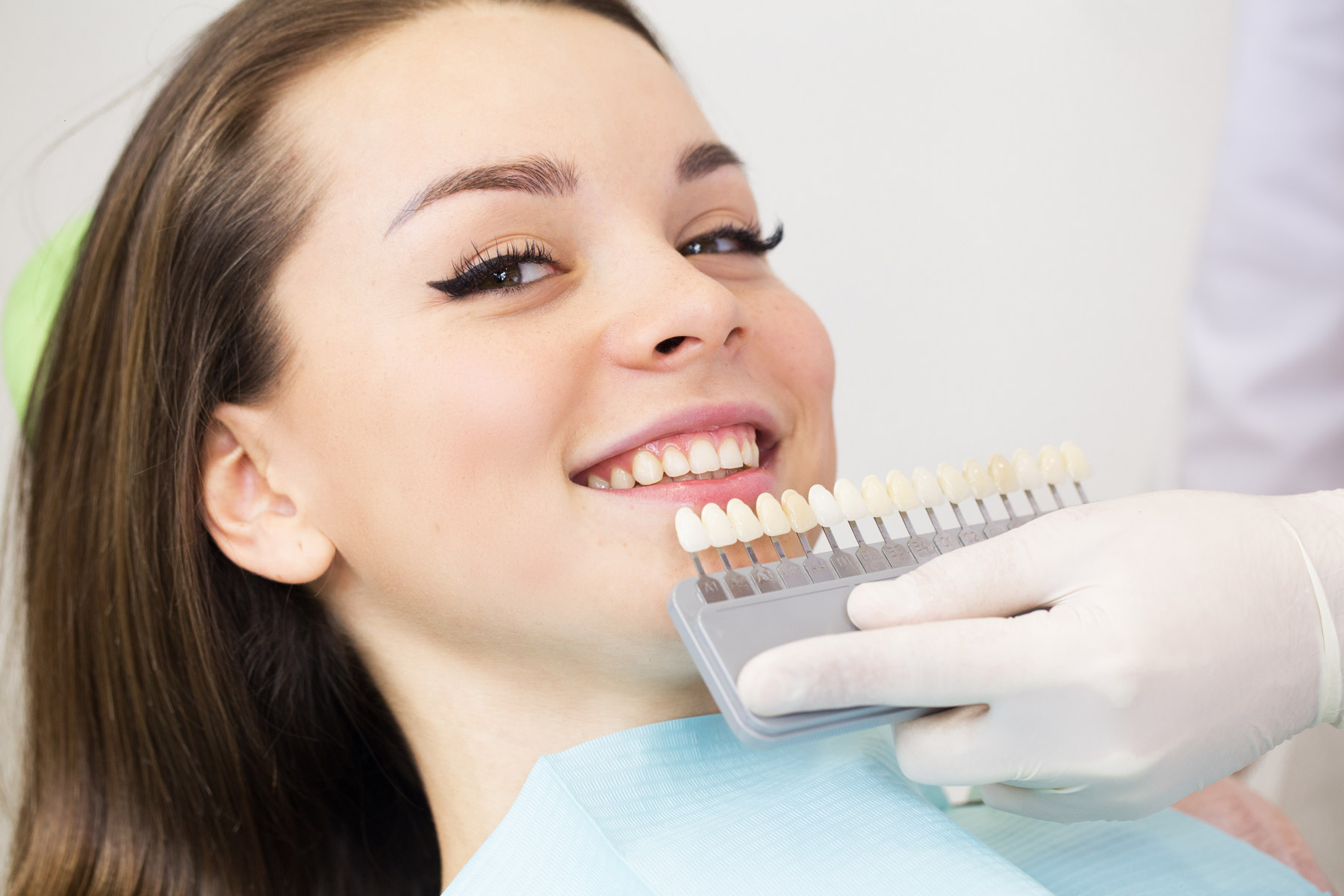 young teenage female patient of Aria Dental choosing Ceramic Crown