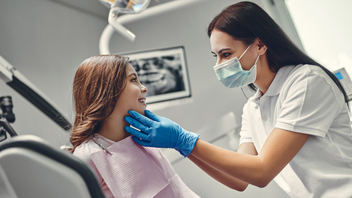 a little girl visiting pediatric dentist