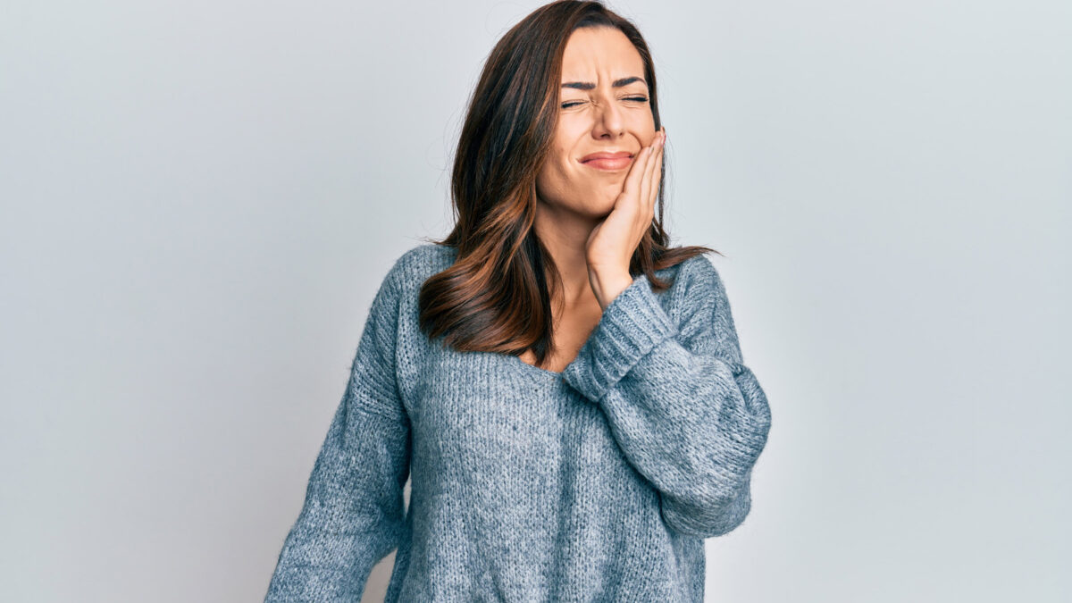 a woman suffering from a tooth wear