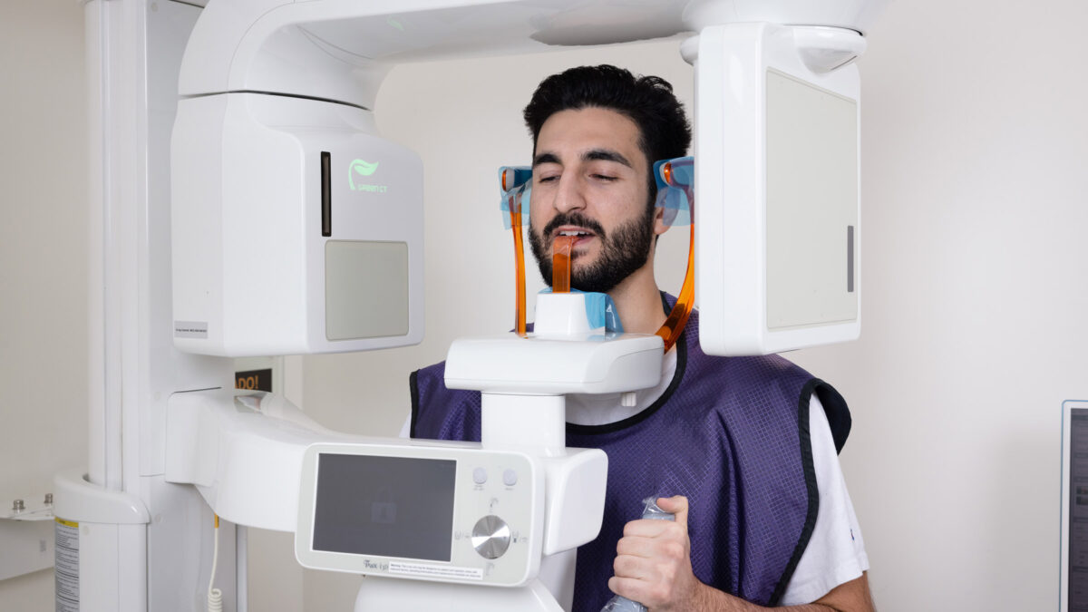 An Aria Dental male patient getting X-Ray at Aria Dental Care office