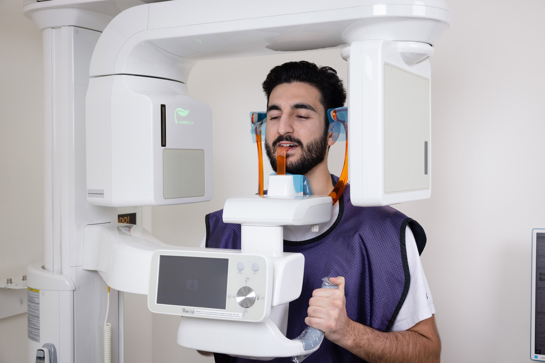 an Aria Dental male patient getting X-Ray at Aria Dental Care office