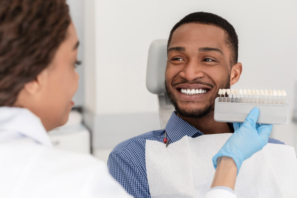 happy Aria Dental Patient choosing dental implant color
