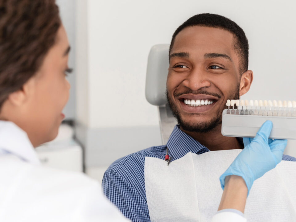happy Aria Dental Patient choosing dental implant color