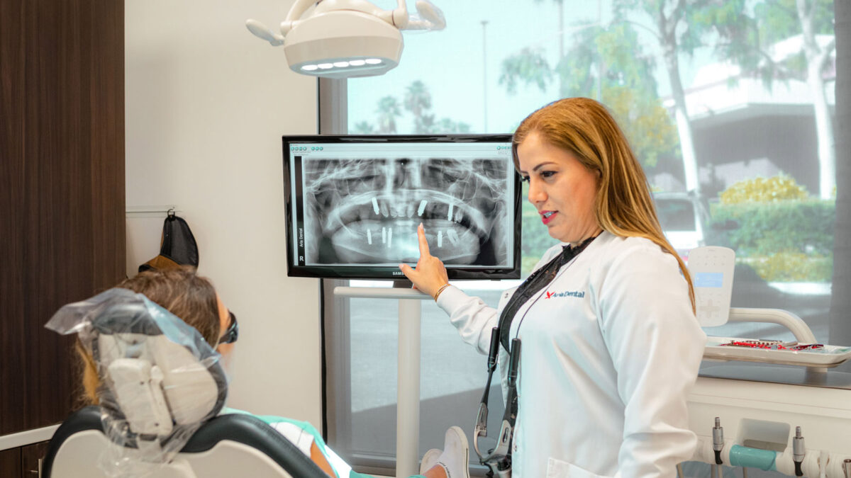 Dr. Maryam Horiyat explaining on a X-Ray Image of patient teeth