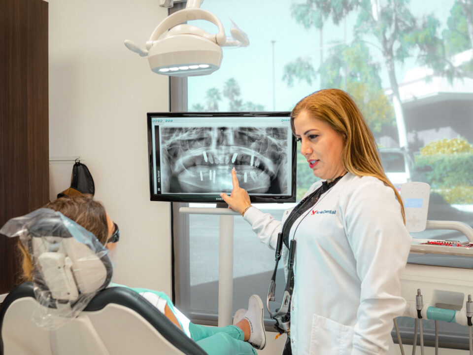 Dr. Maryam Horiyat explaining on a X-Ray Image of patient teeth