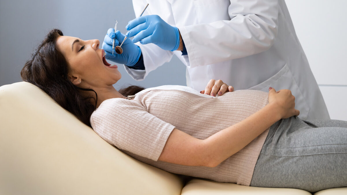 pregnant woman getting dental treatment