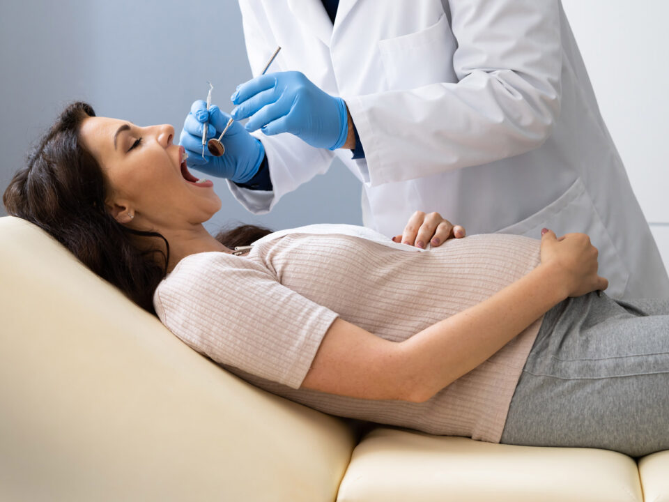 pregnant woman getting dental treatment