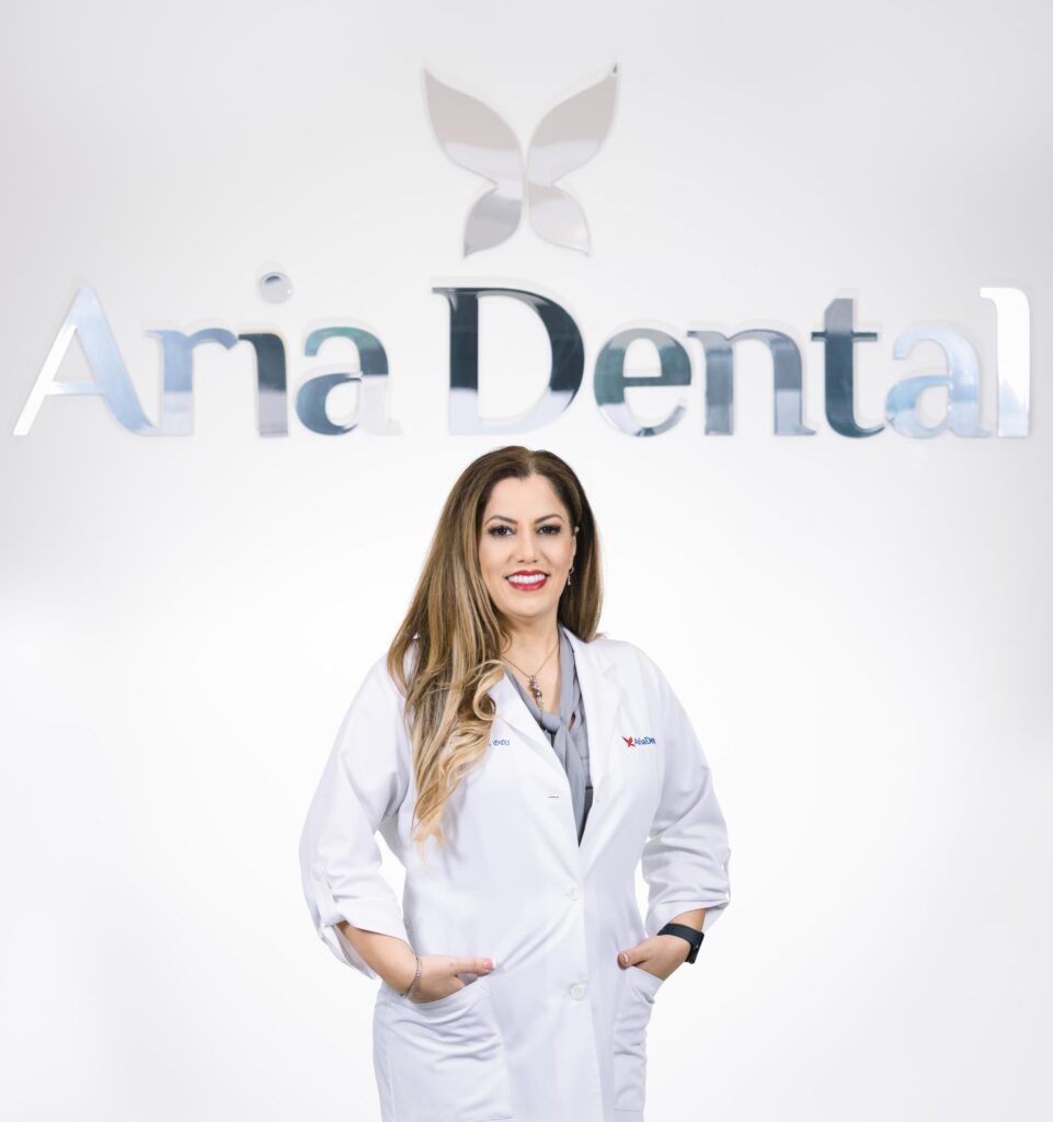 Dr. Maryam Horiyat bellow the logo of Aria Dental