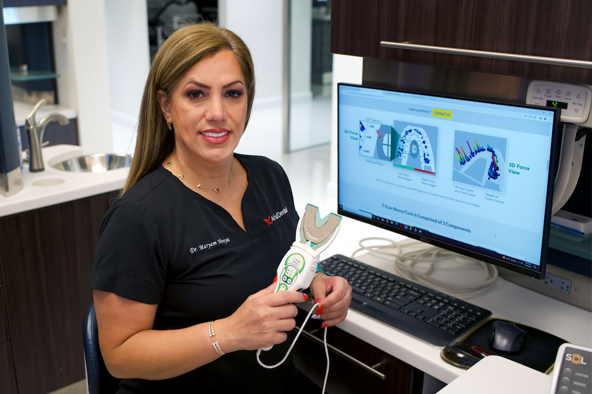 Dr. Maryam Horiyat holding T-scan device