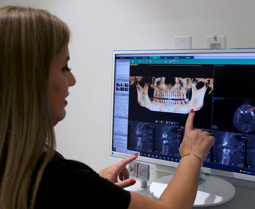 Dr. Maryam Horiyat in office working with CBCT scan device