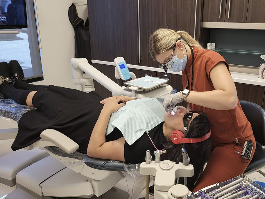 Aria Dental Specialist working on patient's teeth