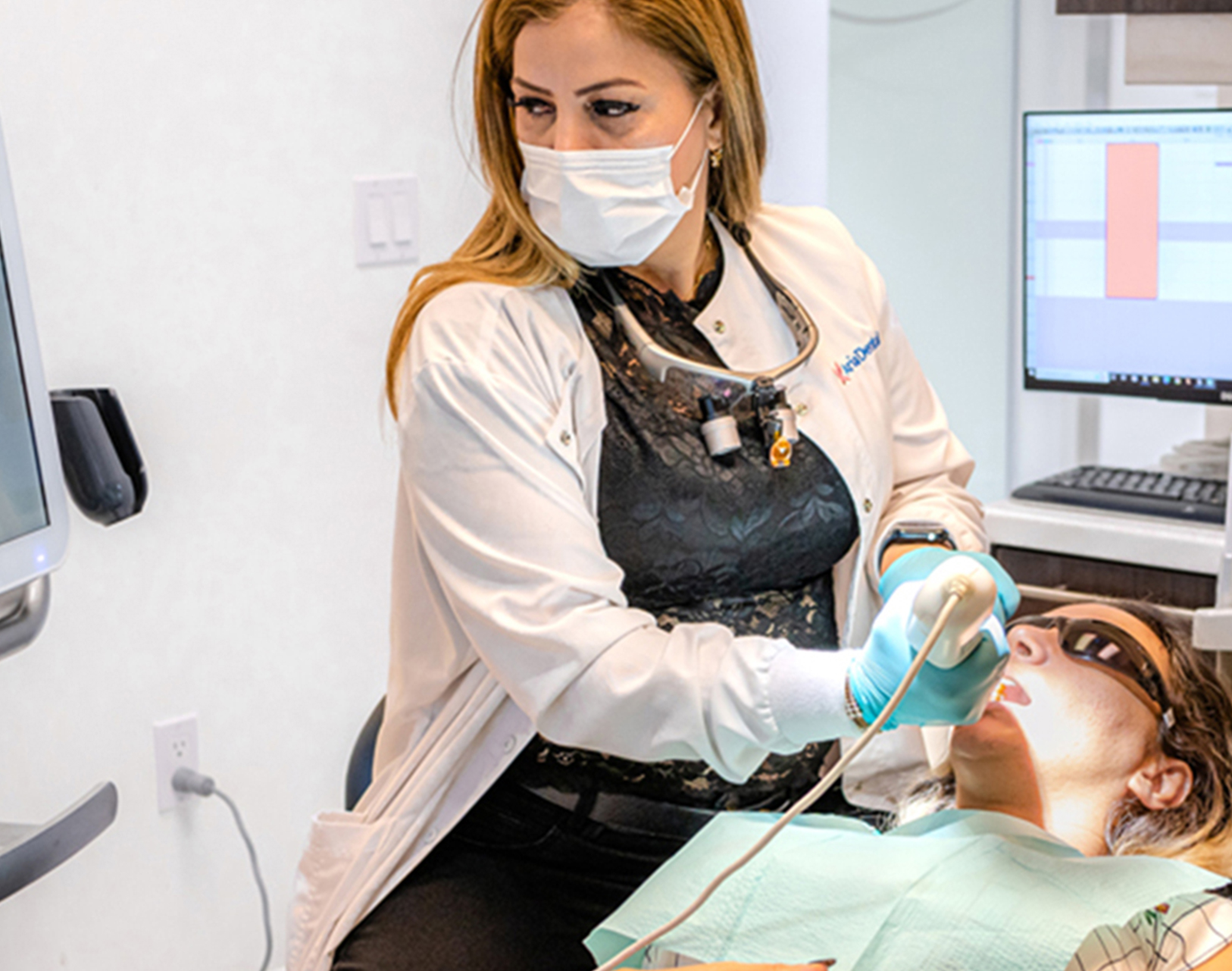 Dr. Maryam Horiyat scanning patient teeth