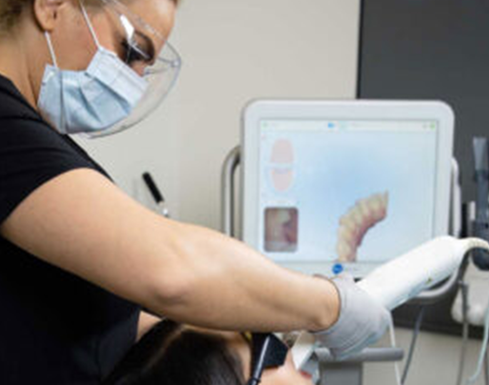 Dr. Maryam Horiyat scanning patient teeth
