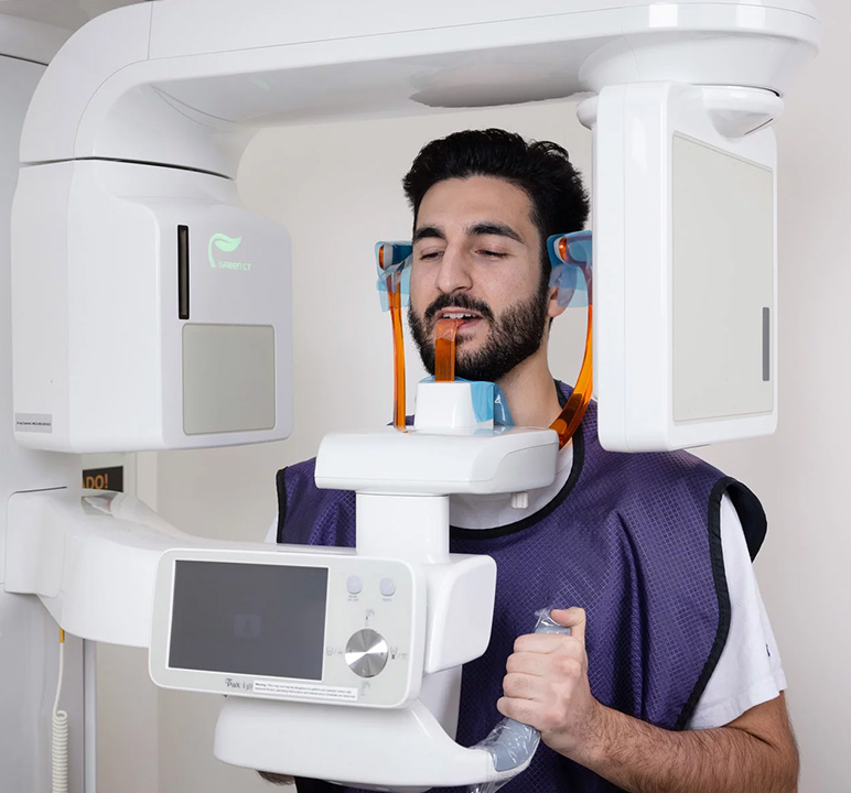 An Aria Dental male patient getting X-Ray at Aria Dental Care office